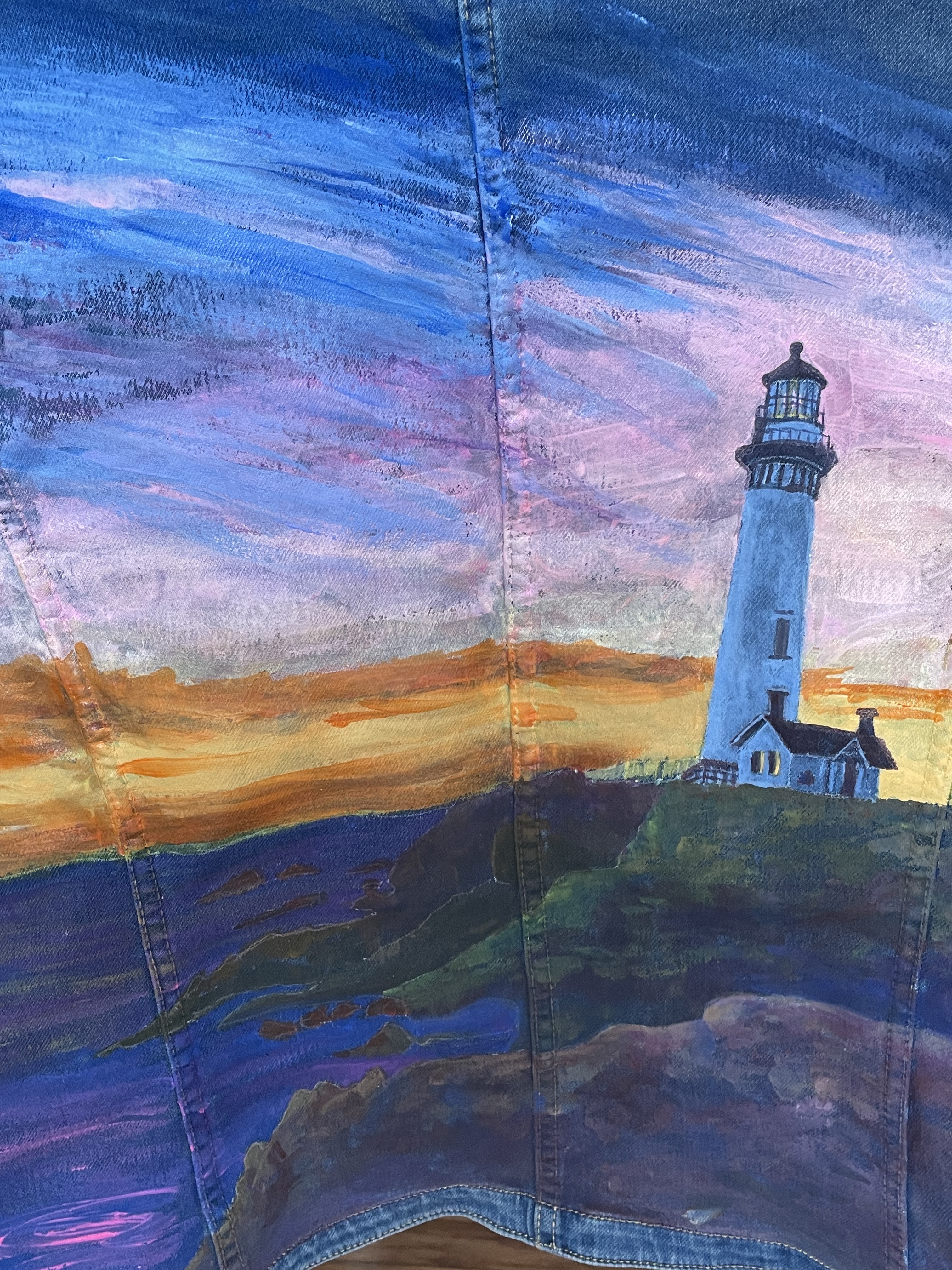 denim jacket with lighthouse painting on the back
