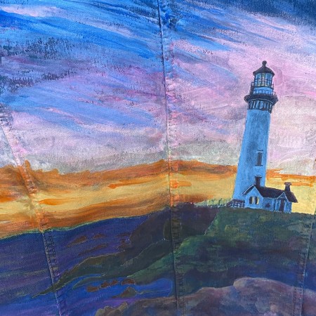 denim jacket with lighthouse painting on the back